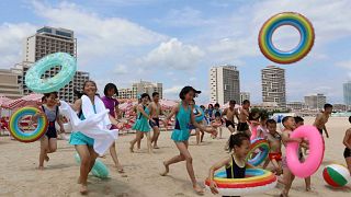Children run into sea at the Wonsan-Kalma resort in Wonsan, Kangwon Province, North Korea, 2 July 2025.