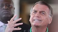 Brazil's former President Jair Bolsonaro gives a press conference outside the Senate in Brasilia, 17 July, 2025